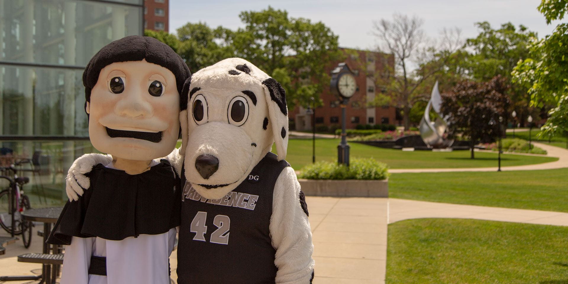 friar dom and huxley mascot on campus